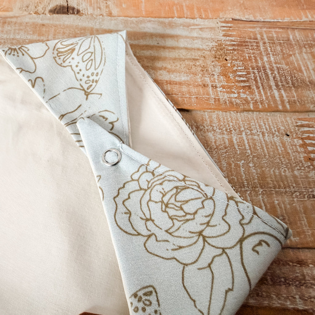 Floral-patterned fabric folded on a wooden surface