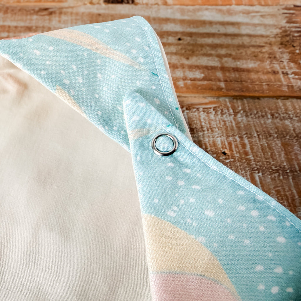 Folded fabric with a polka dot pattern on a wooden surface